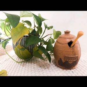 Brown paint stripe ceramic honey pot with comb.